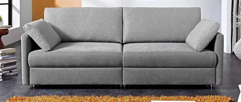 Das FRANKFURT DELUXE Schlafsofa mit schmalen Armlehnen und Armlehnenkissen