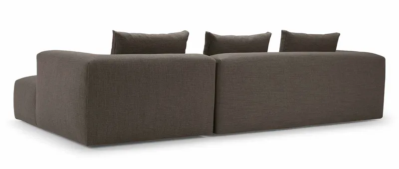 Die Rückenlehne des AALBORG Designer Ecksofas ist komplett im Stoff Ihrer Wahl bezogen, wodurch es auch frei im Raum stehend genutzt werden kann